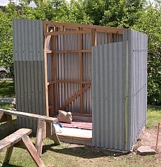 Williams House Paihia - new pumphouse cladding being installed
