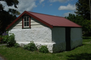 Williams House Paihia - a view of the north side of the stone shed following restoration